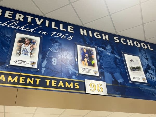 Walls of a school with student athlete placards