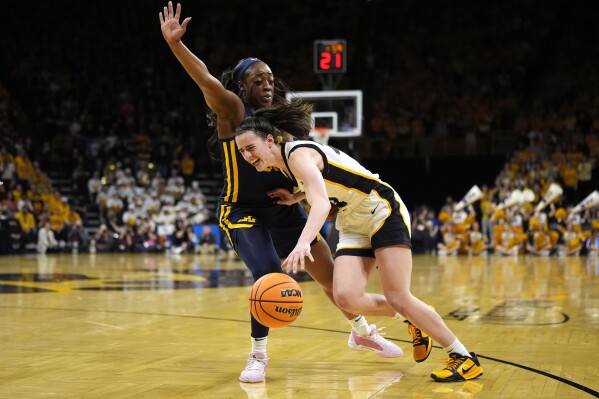 Clark scores 32 as top seed Iowa holds on to beat West Virginia 64-54 | AP  News