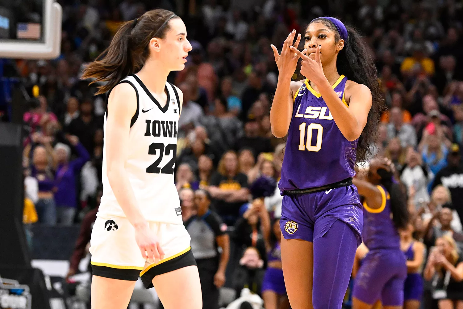 NCAA Finals: LSU Angel Reese (10) taunting Iowa Caitlin Clark (22) and pointing to her ring finger after winning championship game vs Iowa at American Airlines Aren