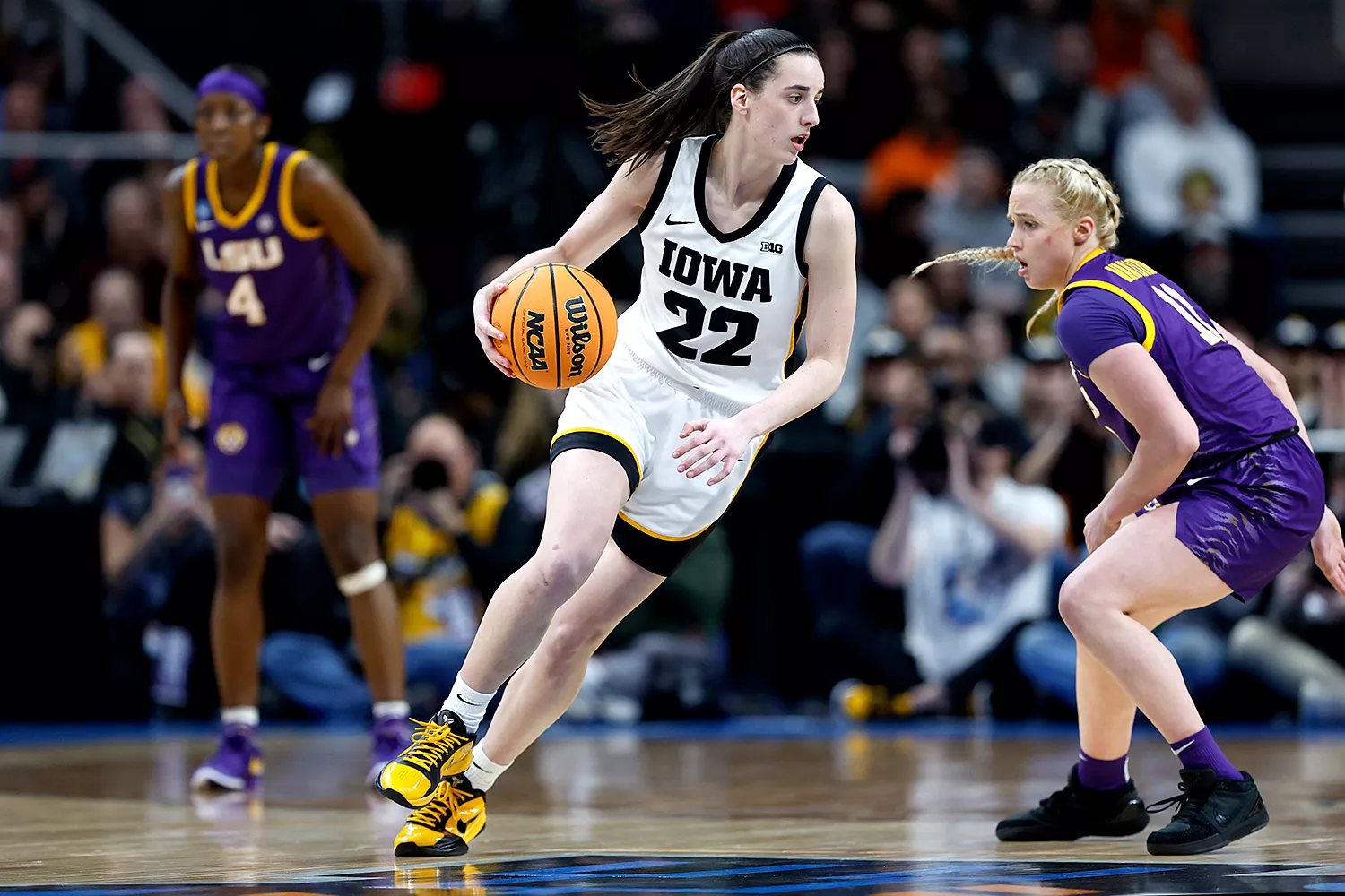 Caitlin Clark #22 of the Iowa Hawkeyes dribbles against Hailey Van Lith #11 of the LSU Tigers during the second half in the Elite 8 round of the NCAA Women's Basketball Tournament at MVP Arena on April 01, 2024 in Albany, New York.