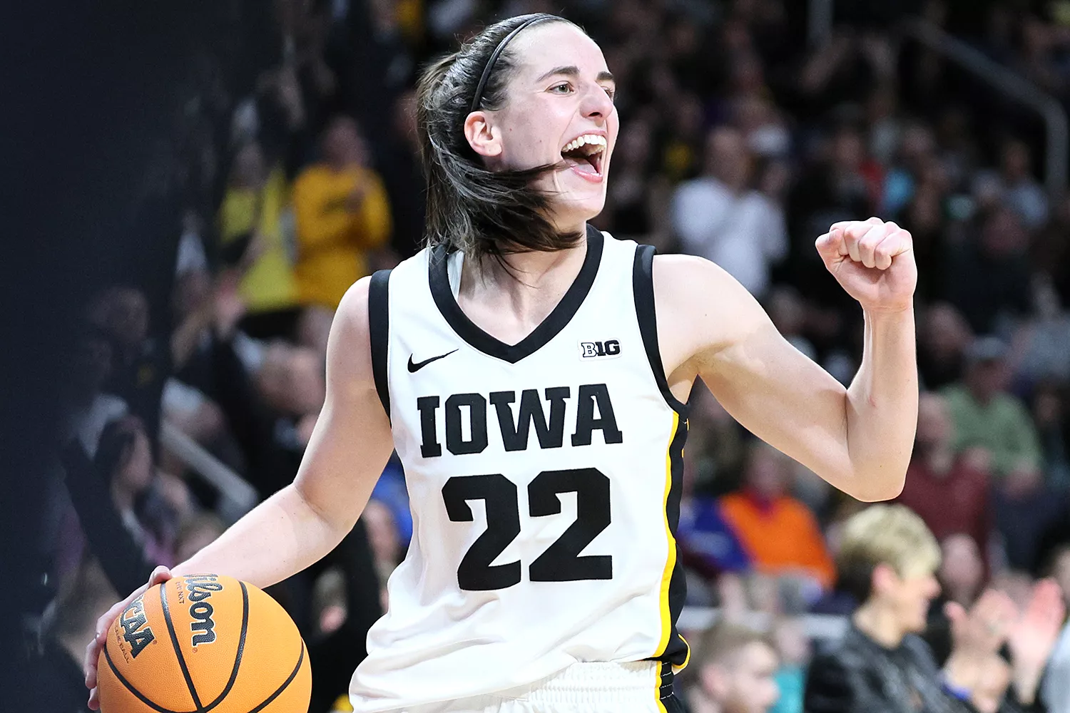 Caitlin Clark #22 of the Iowa Hawkeyes celebrates after beating the LSU Tigers 94-87 in the Elite 8 round of the NCAA Women's Basketball Tournament at MVP Arena on April 01, 2024 in Albany, New York.