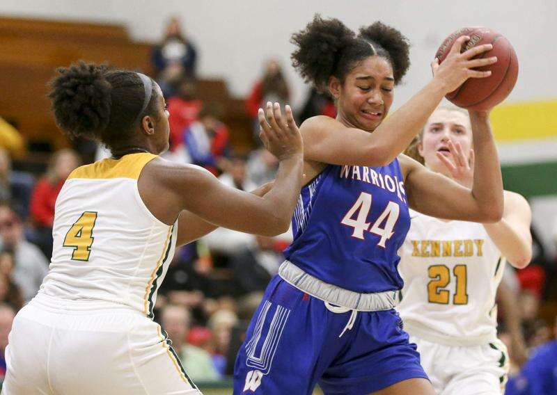 Cedar Rapids Washington's Hannah Stuelke holds onto the ball under pressure in a game at Cedar Rapids Kennedy on Dec. 20, 2019. The Cedar Rapids City Council aims to honor Stuelke, now a star forward with the Iowa Hawkeyes. (The Gazette)