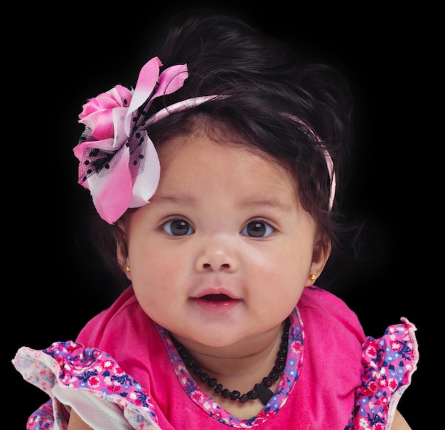 Premium Photo | Portrait baby or girl with an innocent infant in studio on  a black background in floral clothes Kids flower and development with a  female child on dark space for